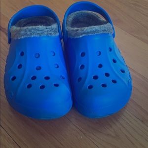 Blue crocs with grey fur